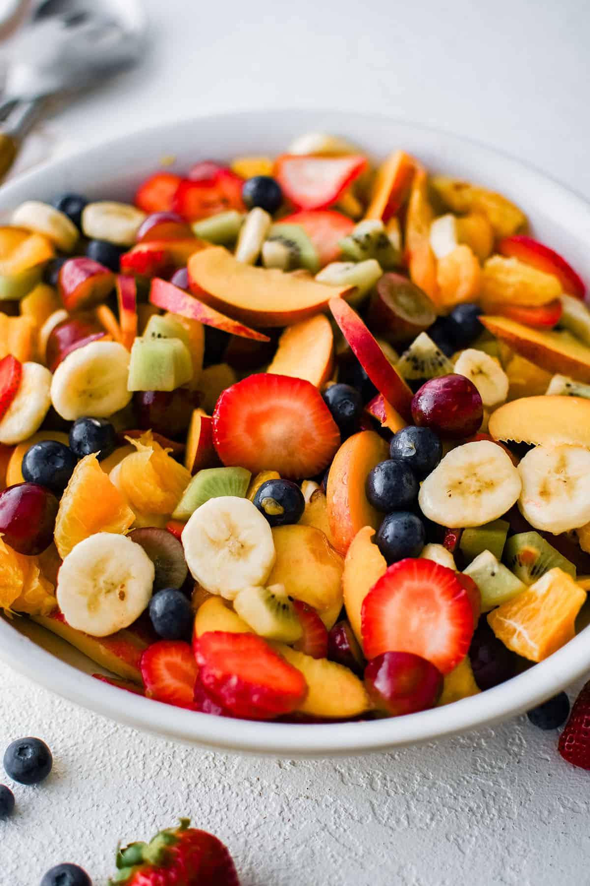 summer fruit salad in a white bowl