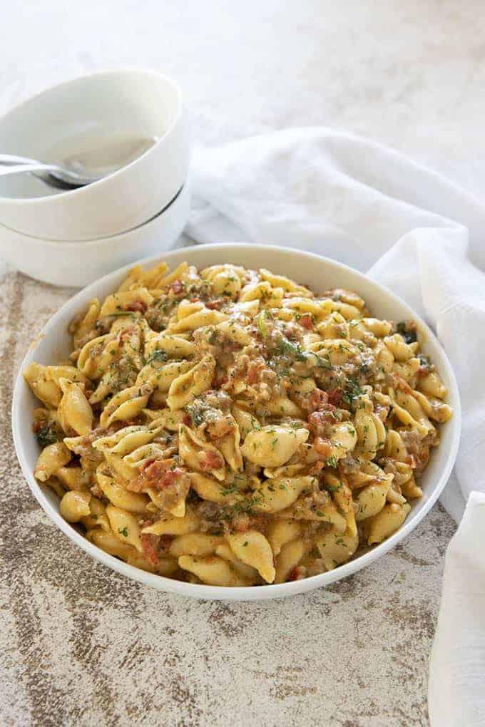 instant pot creamy italian mac and cheese in a white bowl