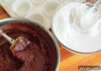 Sunken chocolate cupcake batter in tins