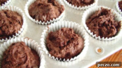 Unbaked sunken chocolate cupcakes in muffin tins