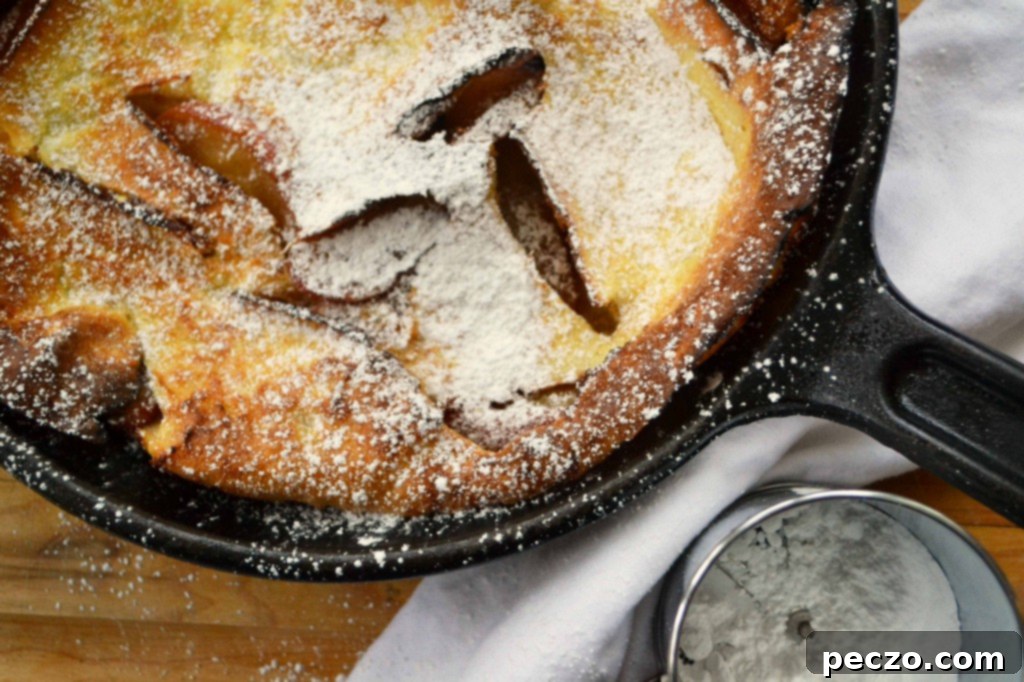 Golden Puffed Apple Pancake with Cinnamon and Sugar