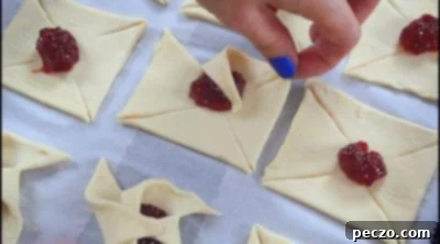 Folding puff pastry to create pinwheels