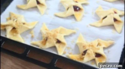 Adding crumb topping to puff pastry pinwheels