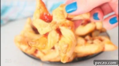 Baked strawberry puff pastry pinwheels