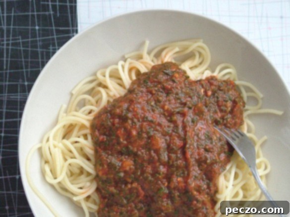 Vibrant spinach spaghetti ready to serve in a bowl, a delicious and healthy meal for the whole family
