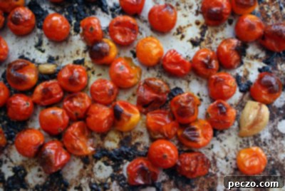 Perfectly roasted cherry tomatoes, caramelized and bursting with flavor