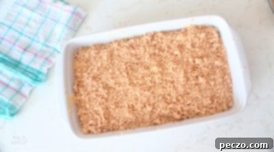 Crumb topping sprinkled over the top layer of cake batter
