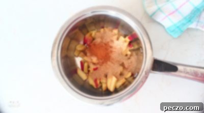 Diced apples cooking with brown sugar and cinnamon for apple pie filling
