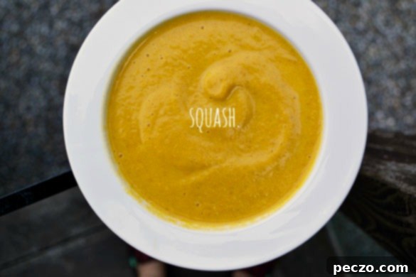 Delicious and creamy butternut squash soup in a bowl, garnished with herbs