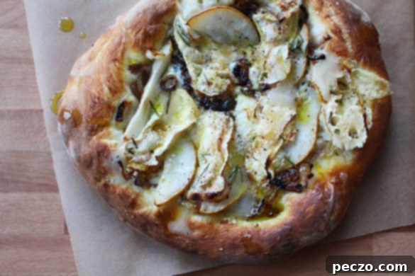 Finished Pear & Brie Flatbread, sliced and ready to serve