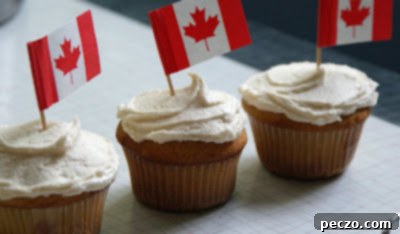 Decorated maple cupcakes ready for a Canada Day celebration.