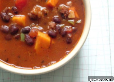 Close-up of Hearty Sausage, Black Bean & Sweet Potato Soup