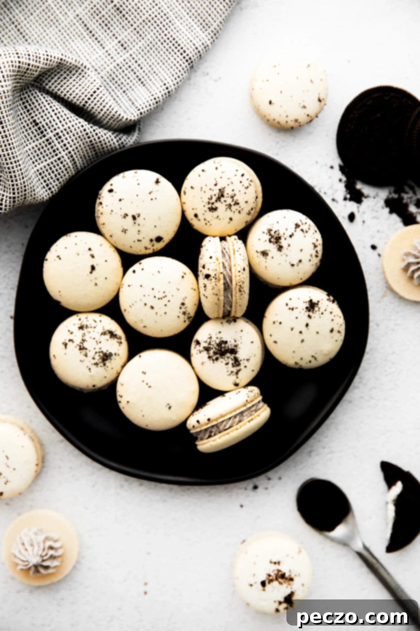 Many finished French Oreo macarons stacked and arranged artfully, ready to be enjoyed.