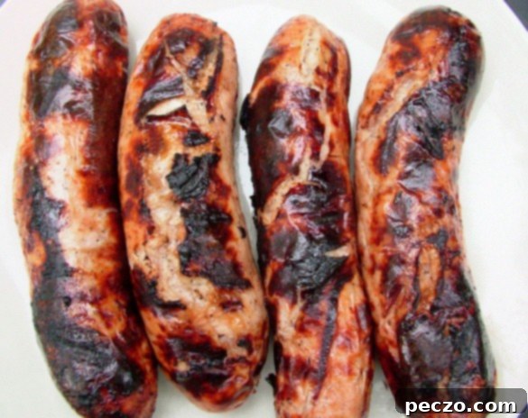 Perfectly grilled chicken sausage with a slight char, ready to be served.