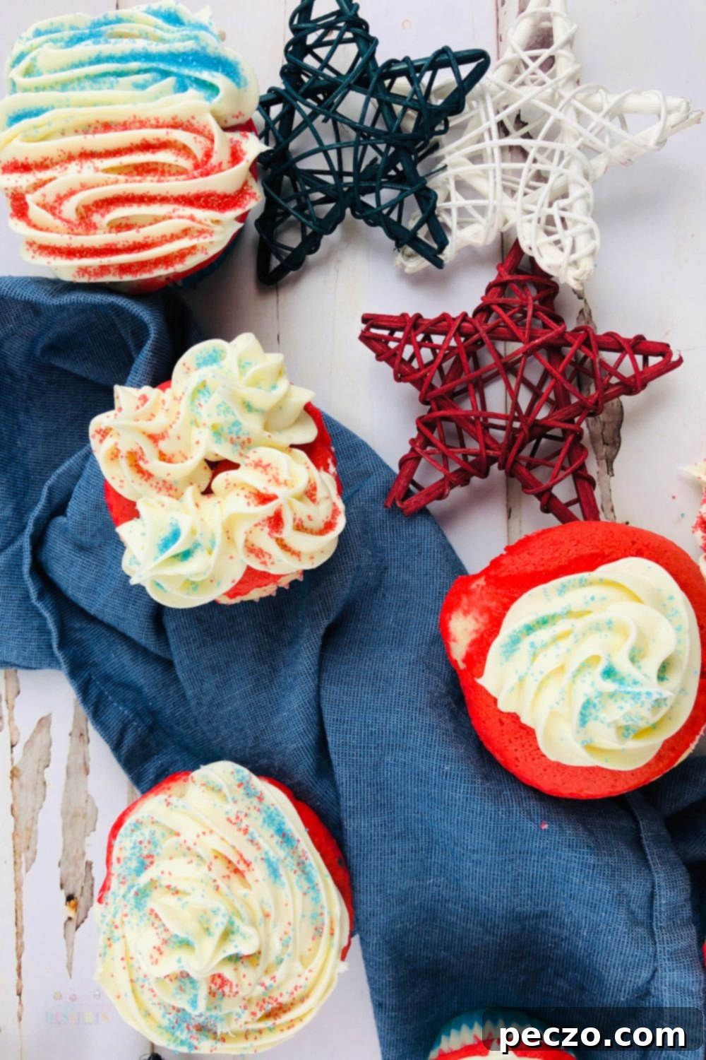 Patriotic cupcakes with distinct layered batter and colorful sprinkles