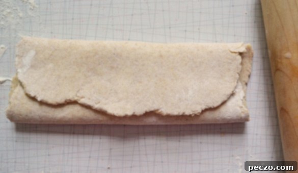 The folded scone dough, resembling packages, placed on a baking sheet, brushed with milk and sprinkled with coarse sugar.