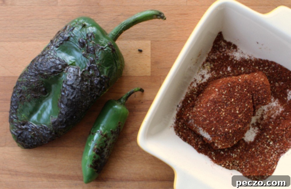 Ingredients for charred pepper aioli including charred peppers and fresh cilantro
