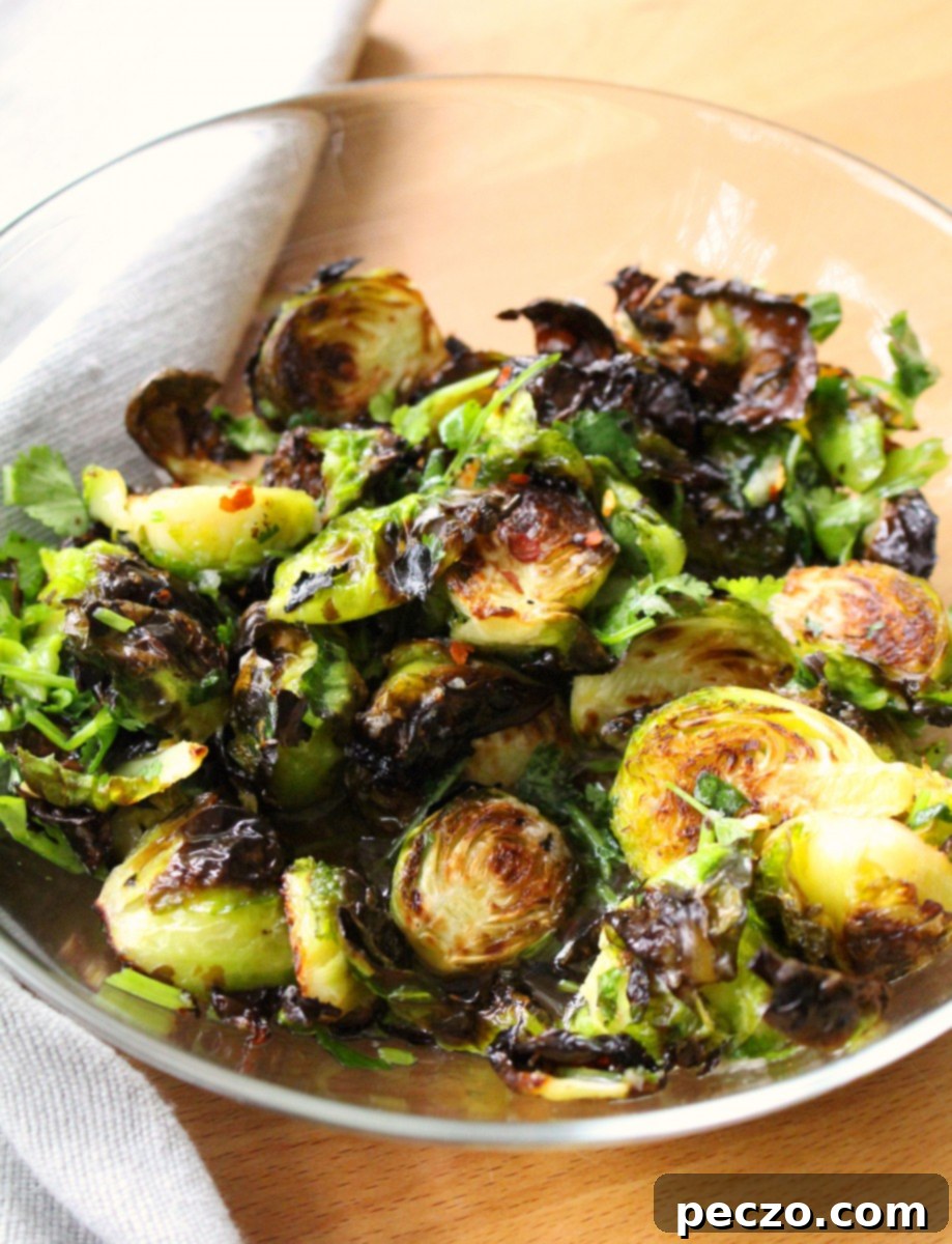 Close-up of crispy roasted Brussels sprouts with fish sauce dressing