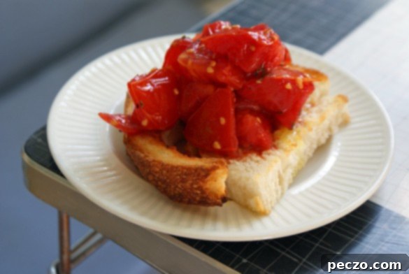 Freshly picked red tomatoes from a home garden, showcasing a bountiful harvest.