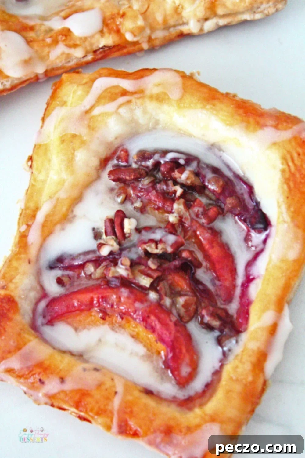 Image of peach pastry made with fresh peaches, pecans and puff pastry