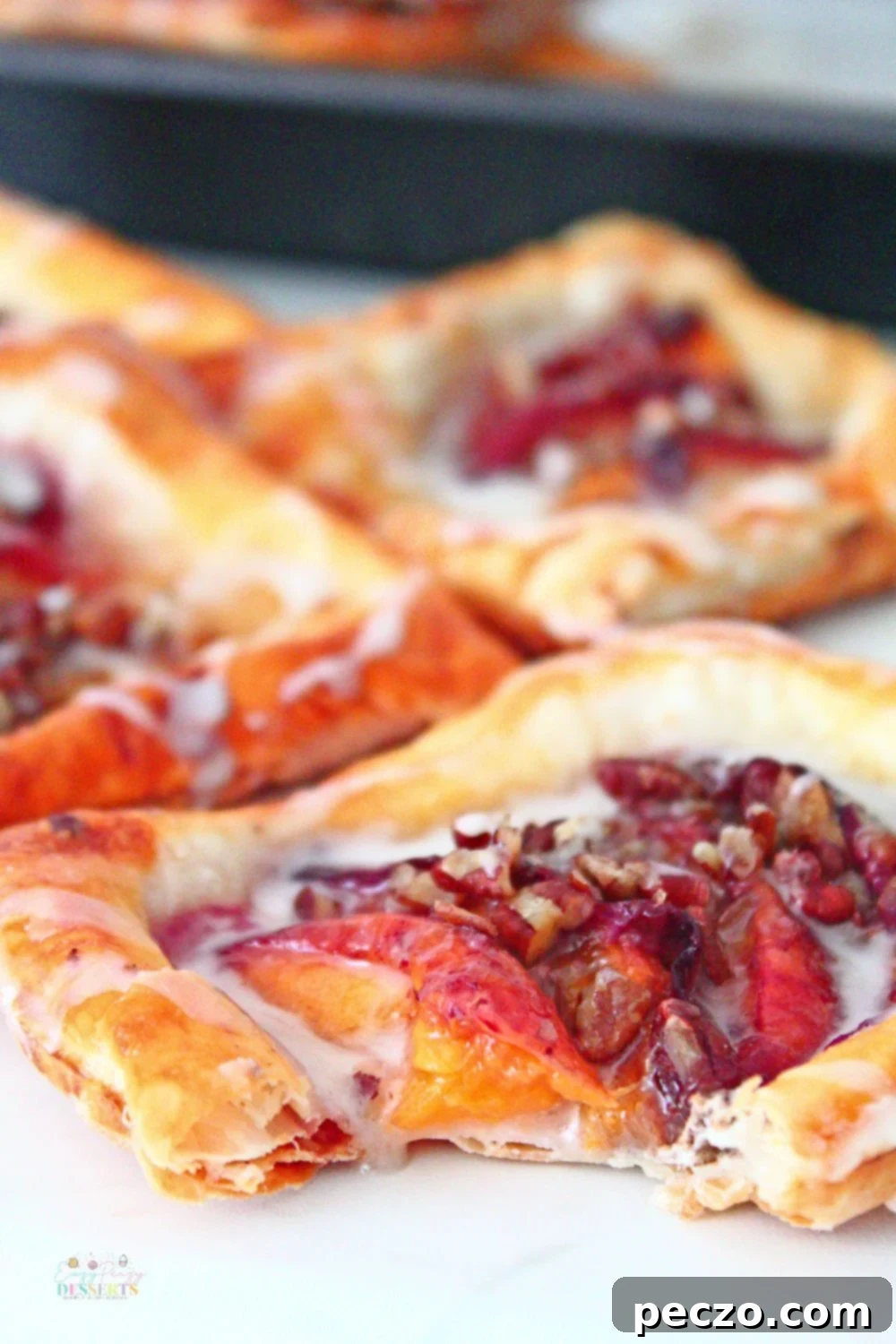 Close up image of peach Danish pastry