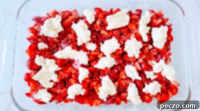 Cream cheese dollops over strawberries
