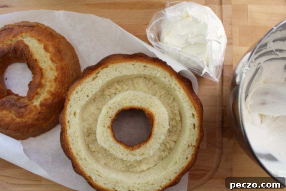 Piping the creamy Twinkie filling into the hollowed bundt cake
