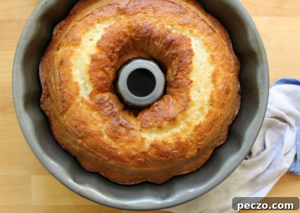 Top view of the bundt cake, showing the golden exterior before hollowing