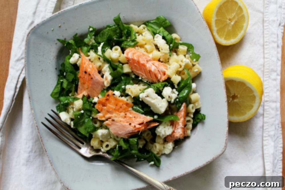 Close-up of fresh Spinach & Feta Pasta Salad, highlighting the small pasta shapes, crumbled feta, and leafy spinach