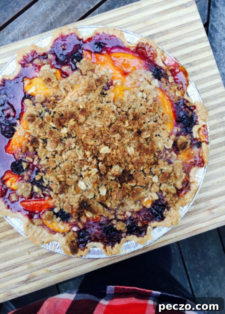 Delicious stone fruit crumble pie ready to be served