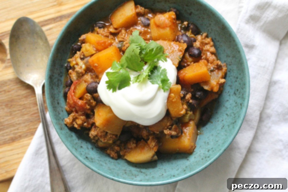 Close-up of a bowl of homemade turkey chili with butternut squash