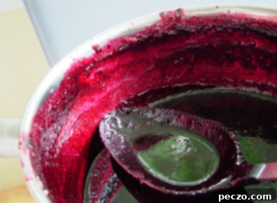 Black Currant Jam simmering in a pot