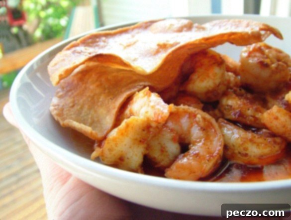 Delicious Barbecue Shrimp served in a bowl, glistening with buttery sauce