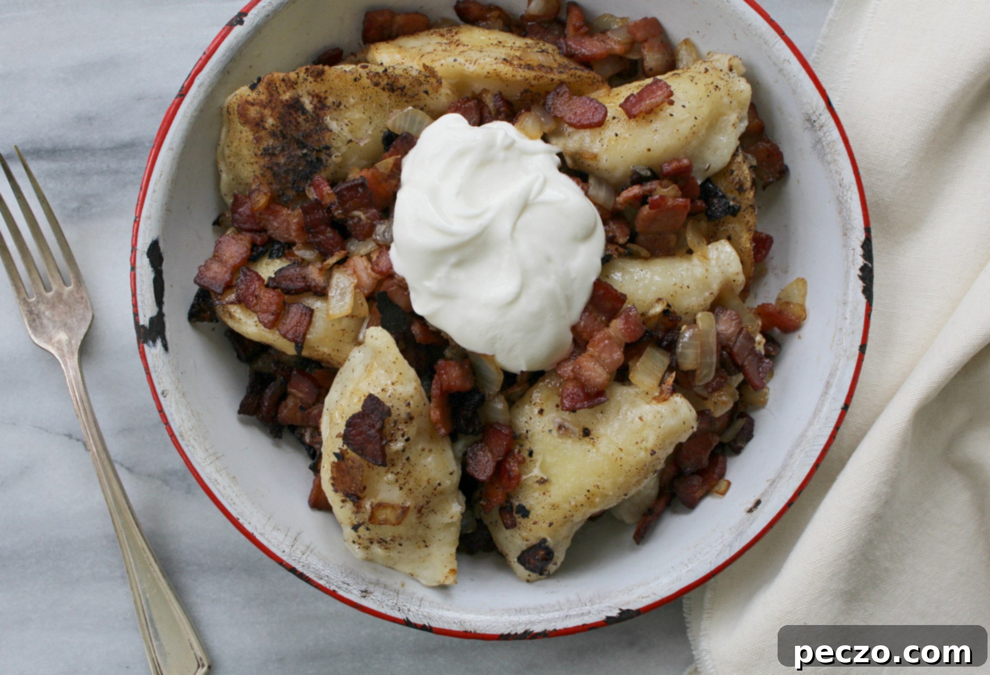 Bacon Double Cheese Peroghies with a generous serving of caramelized onions