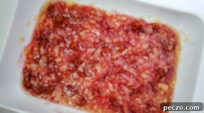 Mixing crushed pineapple and cherry pie filling