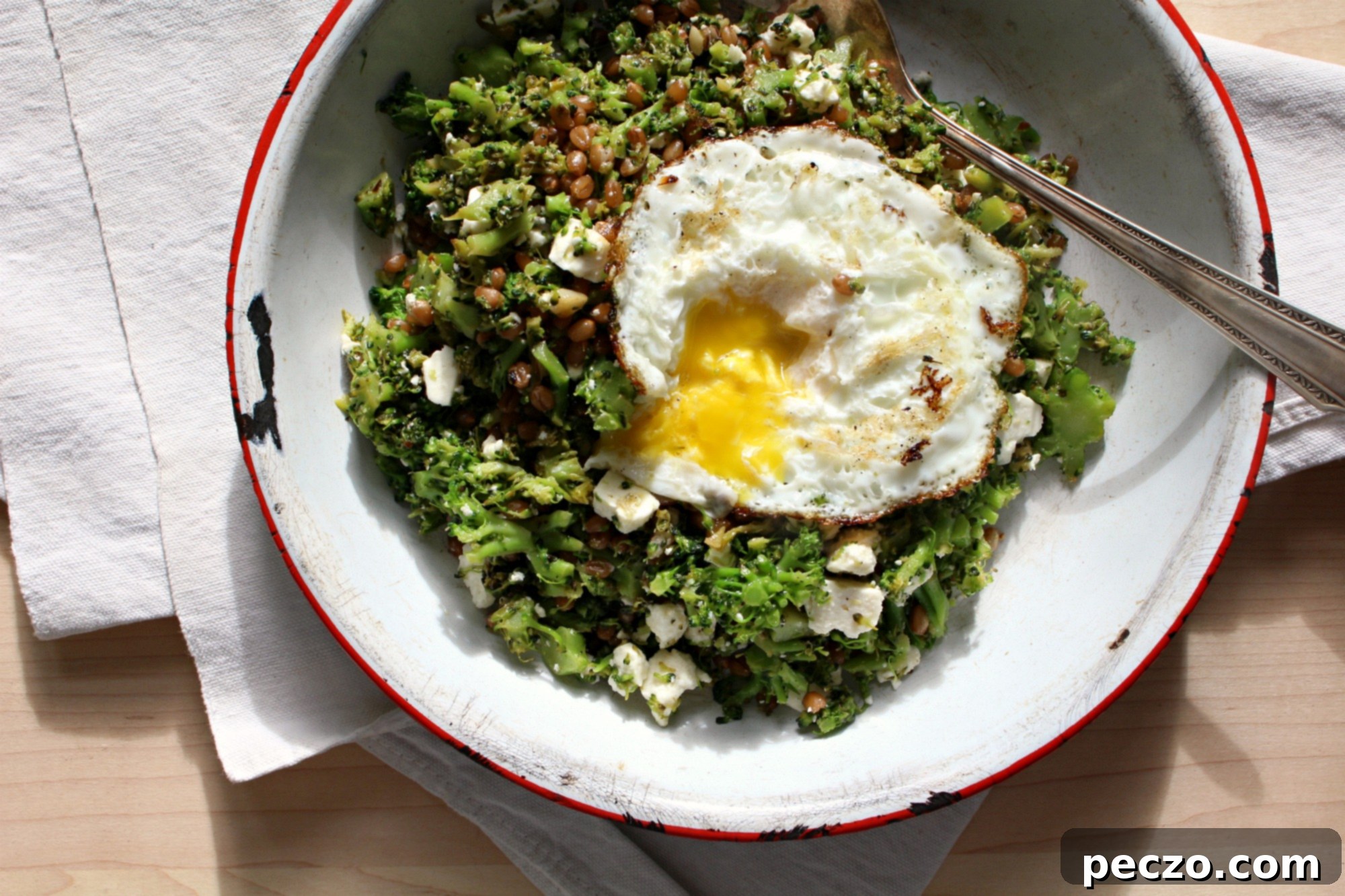 Rustic broccoli rubble with a perfectly fried egg on top, showcasing a healthy and vibrant meal ready to be enjoyed.