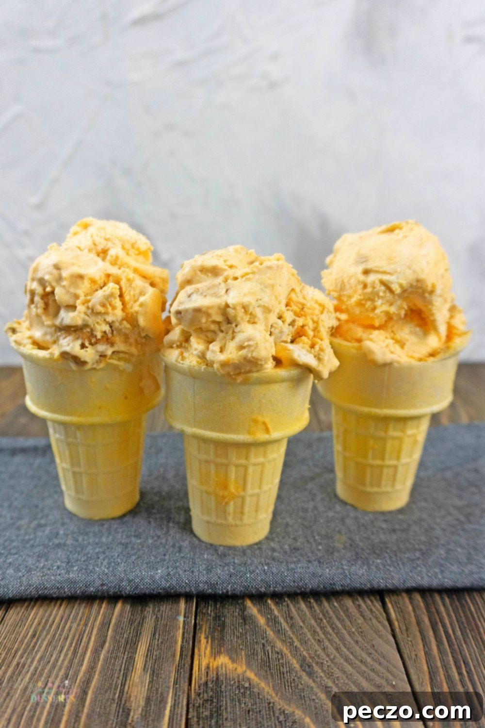 Pumpkin ice cream in three ice cream cones