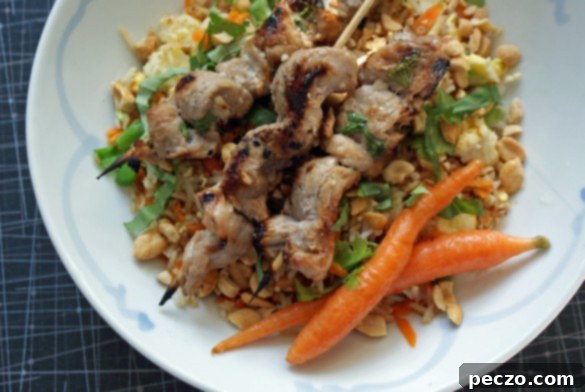Delicious Vietnamese chicken satay skewers grilling to perfection