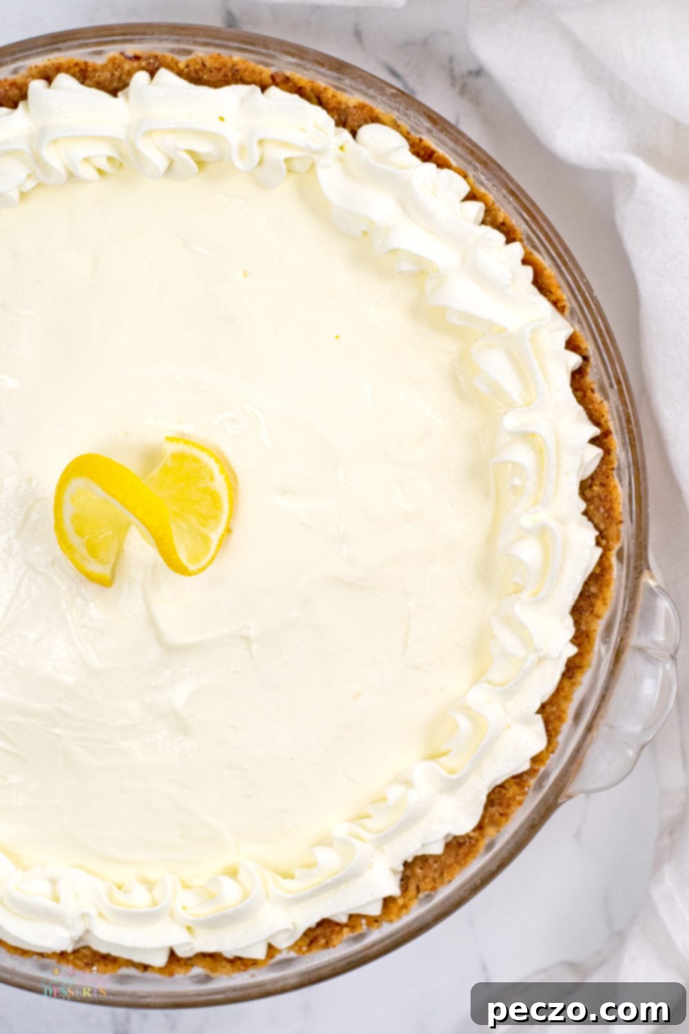 Close up image of a whole lemon pie