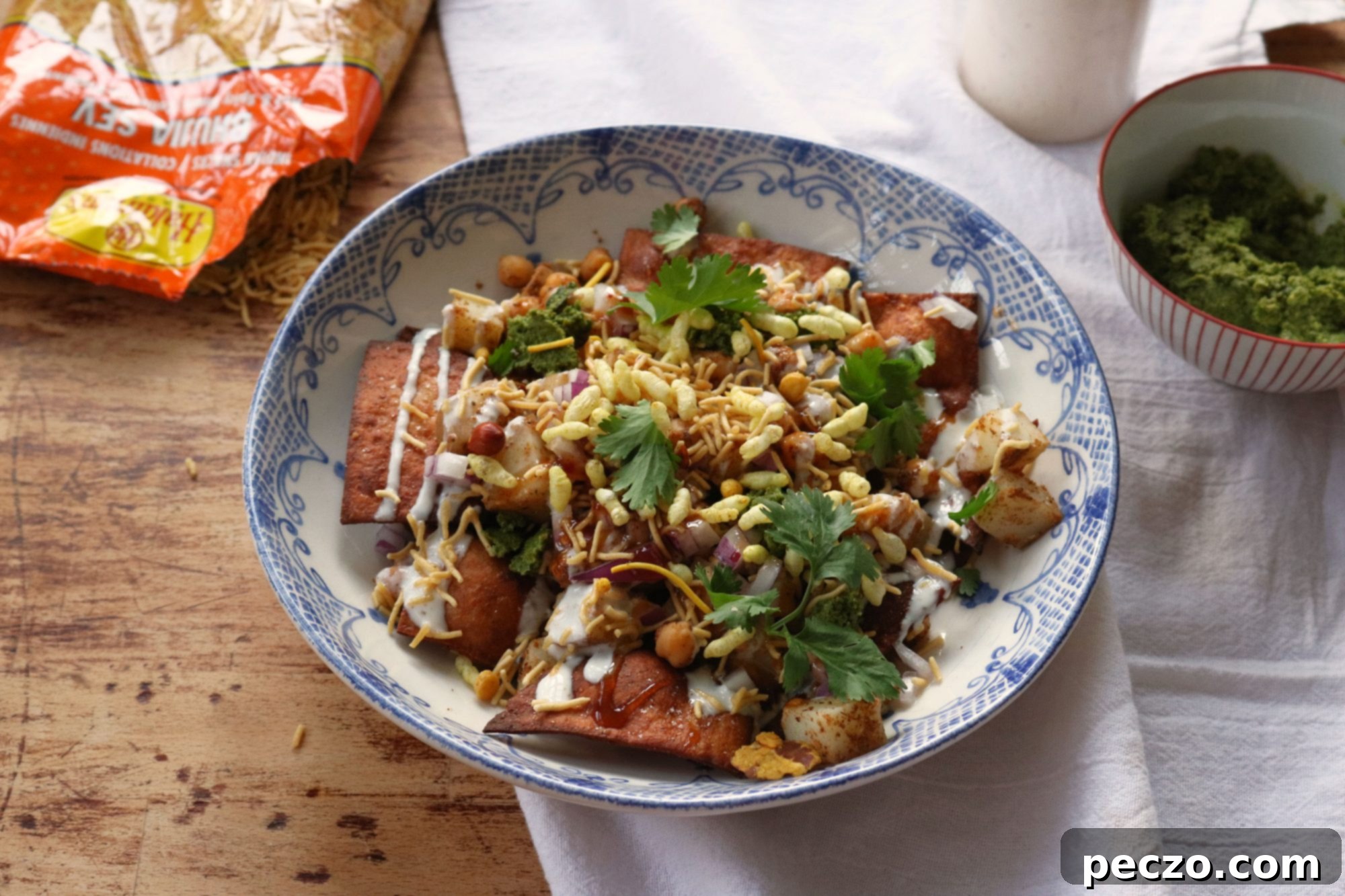 A beautifully garnished bowl of Papdi Chaat ready to be served, showcasing vibrant colors and textures.