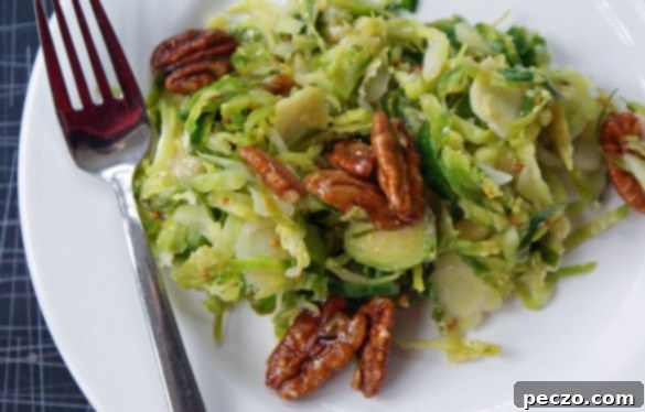 Maple Glazed Pecan Brussels Slaw with Grainy Mustard 1 Freshly prepared Brussels sprouts slaw, vibrant and ready to eat.