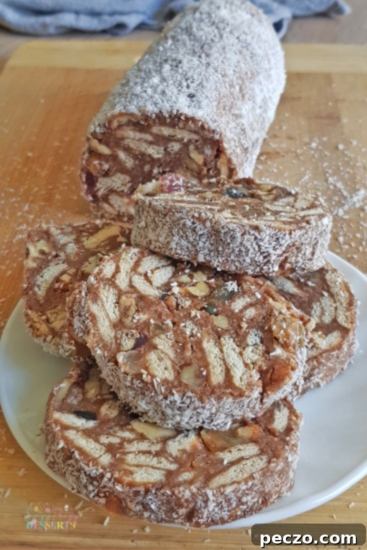 Chocolate salame slices on a platter with cocoa powder dusting