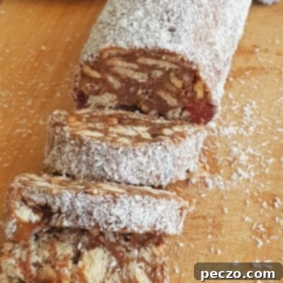 No-bake chocolate salami with biscuits, nuts, and coconut flakes
