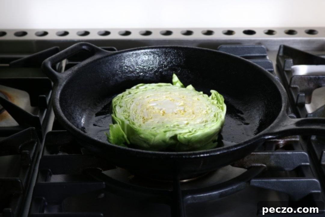 Thickly sliced green cabbage wedges ready for charring