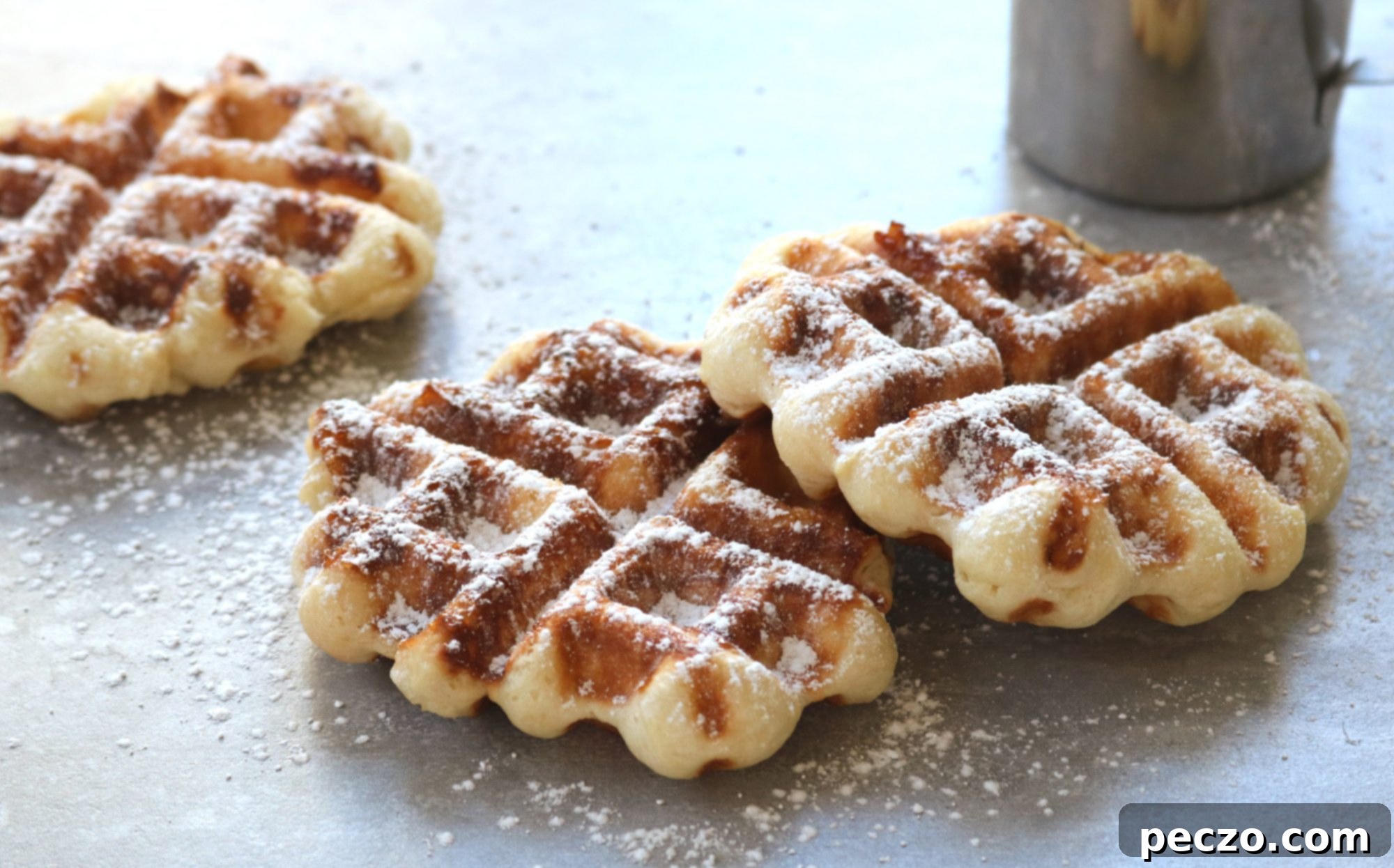 Freshly baked Liège waffles on a cooling rack