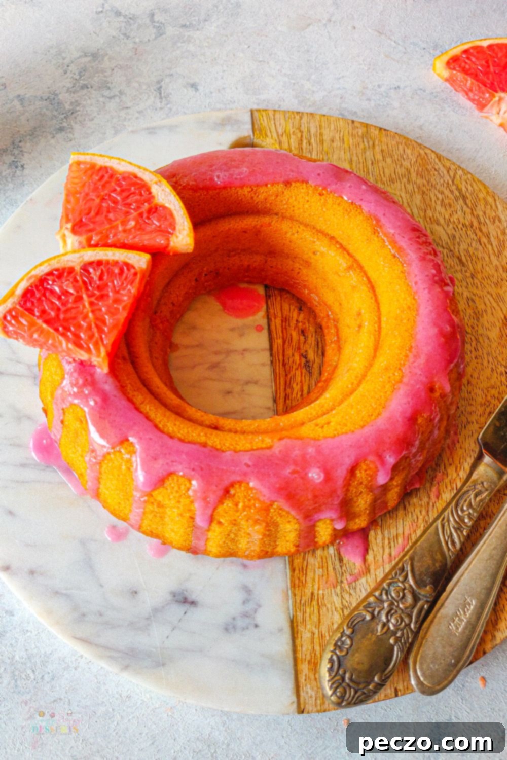 Overhead image of blood orange cake glazed with blood orange icing