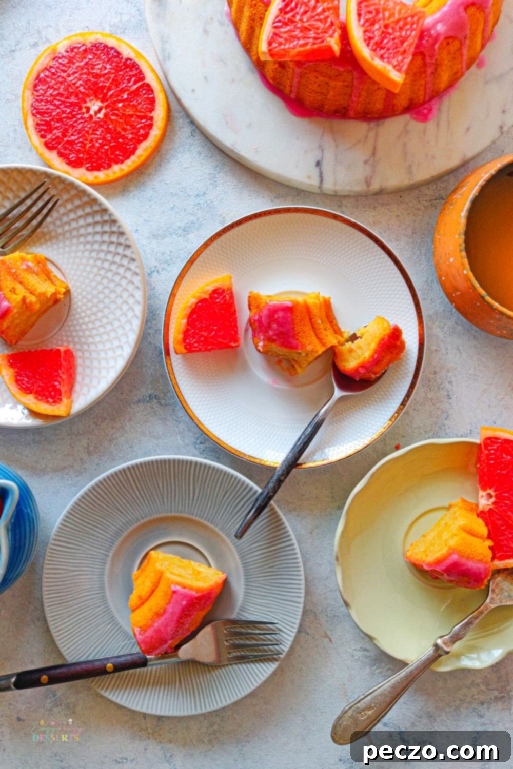 A few slices of blood orange bundt cake in dessert plates