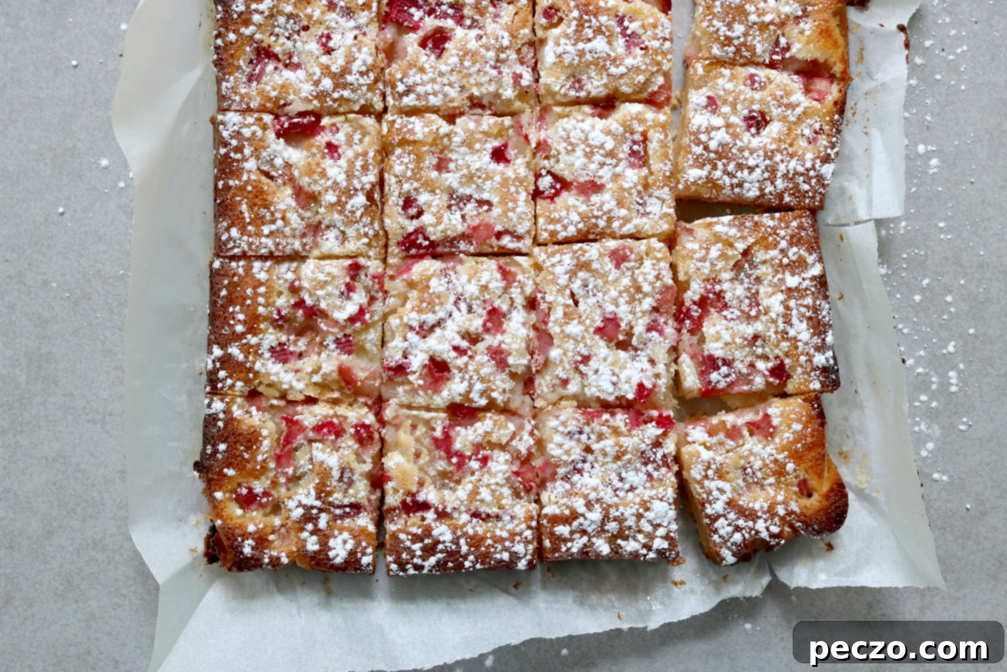 Rhubarb Lemon Bars with a perfect crust and filling, dusted with powdered sugar.