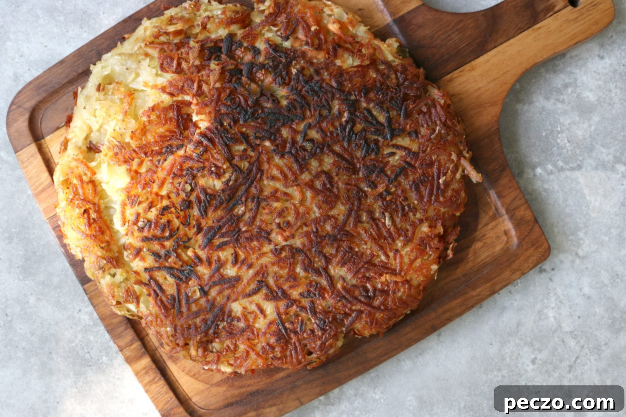 Close-up of a Jarlsberg Rösti, showing the crispy texture and golden color.