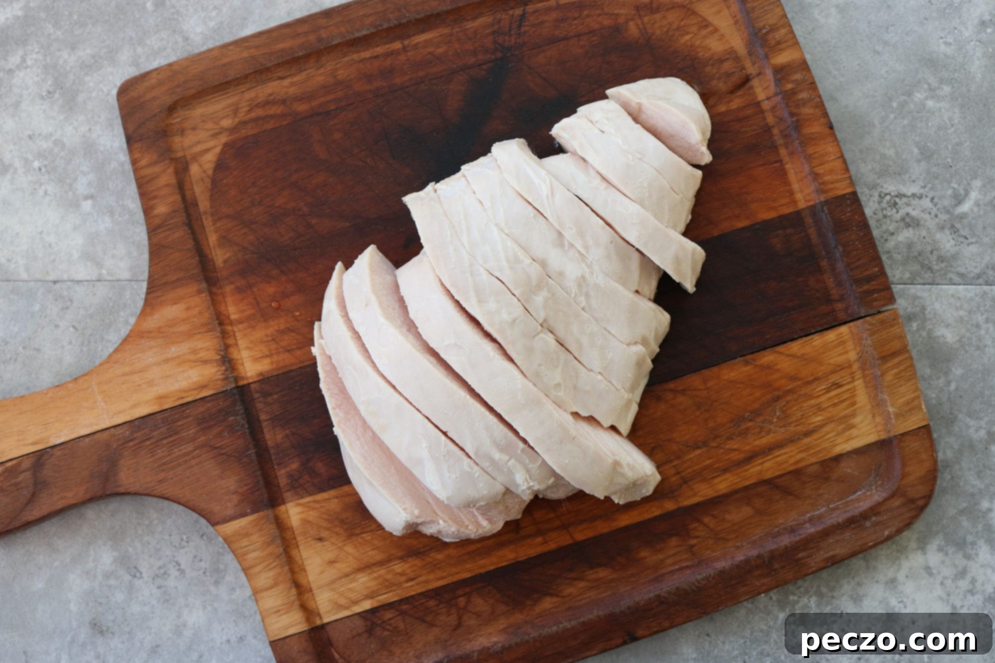 A close-up shot of a pot filled with delicious smothered turkey, ready to be served.
